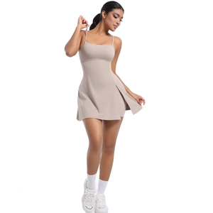 Detailed front view of a beige athletic dress with thin straps and side slit hem