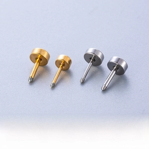 Macro shot of titanium steel cartilage studs in 1.2mm and 0.8mm screw sizes