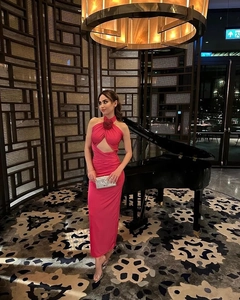 Detailed view of the pink halter dress featuring a 3D rose and sexy waist cutout design