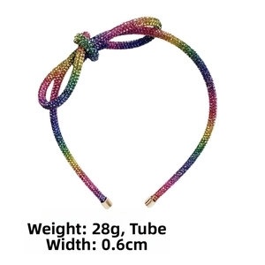 Detail view of a sparkling rainbow rhinestone headband with a bow and 0.6cm width