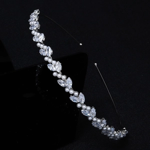 Elegant leaf crown headband with zircon crystals and pearls on a black background