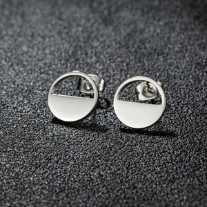 Minimalist silver stainless steel geometric round stud earrings with a matte brushed finish