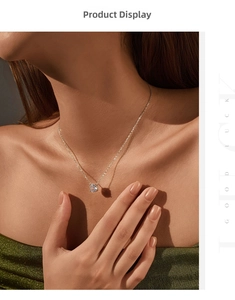 Close-up of S925 sterling silver necklace with a brilliant-cut diamond pendant on model