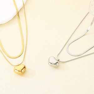 Double-layered stainless steel necklace featuring a polished puffy heart pendant for women