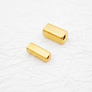 Macro shot of gold matte rectangular beads for DIY jewelry making in stainless steel