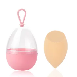 Nude make-up spons met roze hangende opbergdoos voor een gemakkelijke reis-set