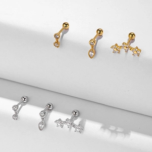 Detail showing s925 silver flower and star earrings with zircon inlay on white steps