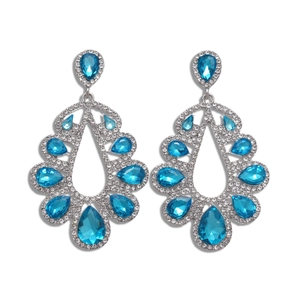 Vintage silver earrings with blue teardrop crystals and sparkling rhinestones on white background