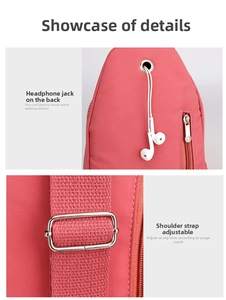 Detail of pink crossbody bag with earphone port, metal zipper and adjustable strap