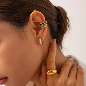 18K gold plated titanium earrings with colorful enamel and eye ring set on model