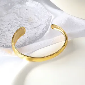 Minimalist wide gold-plated stainless steel C-shape cuff bracelet in elegant setting