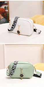 Close-up of woven texture handbags with cat charms and branded wide shoulder straps