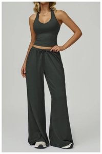 Detail of high-waisted wide leg yoga pants with drawstring and brushed fabric texture