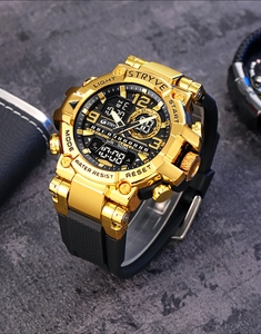 Close-up of golden and black STRYVE dual display sports watch on dark textured table