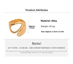 Detailed view of gold metal cuff bracelet with wavy texture and dimensions 6.5cm by 5.5cm