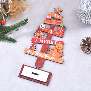 Wooden Christmas tree tabletop ornament with festive greeting on white plush background
