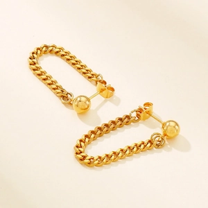 Detail of gold-plated stainless steel tassel chain earrings with curb chain and stud design