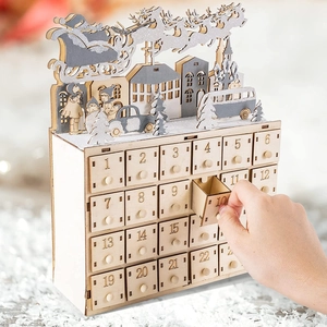 Wooden Christmas advent calendar with 24 drawers featuring laser-cut reindeer village scenes