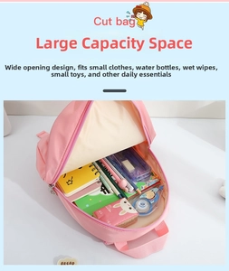 Detailed internal view of pink kids backpack showing spacious storage for school supplies