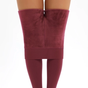 Close-up of thick wine red thermal leggings featuring soft warm fleece lining texture