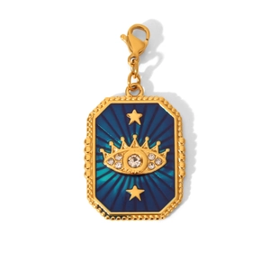 Detailed close-up of a blue enamel heart pendant with gold crown and sparkling eye motif
