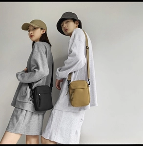 On-body view of black and khaki nylon crossbody bags for men and women