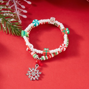 Detailed view of Christmas beaded bracelet with festive clay charms and snowflake pendant