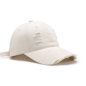 Vintage cream distressed baseball cap with ripped details and frayed brim for outdoor sports
