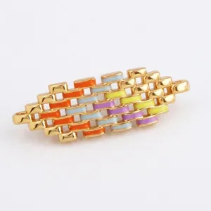 Detailed macro view of 19mm gold-plated copper connectors with colorful enamel weaving