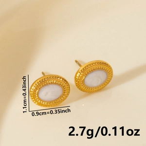 Detail of round gold earrings with white shell inlay showing size 1.1cm and 2.7g weight