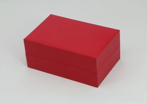 Detail view of the red PU leather rectangular watch box with a premium textured finish