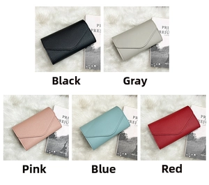 Close-up of stylish envelope clutches in black, grey, pink, blue and red finishes