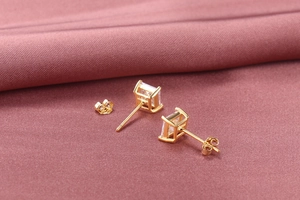 Close-up of S925 silver square zircon stud earrings with gold plating and butterfly backings