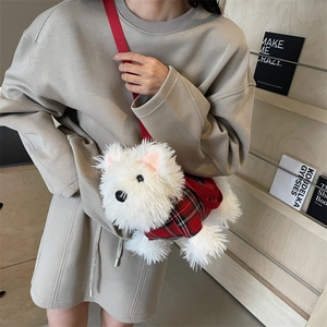 White Westie plush crossbody bag with red plaid vest worn by model on beige dress