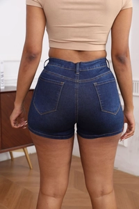 Rear view of high-waisted dark blue denim shorts with classic pockets and yellow stitching