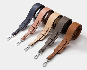 Detail of adjustable cowhide leather purse straps in multiple colors with metal hooks