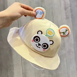 Detail of beige cotton baby bucket hat with cute 3D ears and Lucky Bear cartoon print