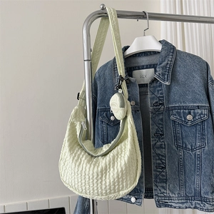 Light green bubble textured crossbody bag with small coin purse and adjustable strap