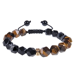 Macro shot of 10mm faceted obsidian and tiger eye beaded bracelet with gold crystal spacer