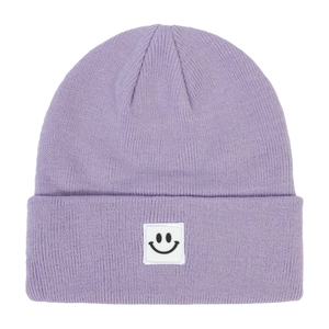 Detail of purple ribbed knit beanie featuring a white square smiley face woven patch