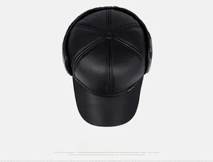 Top view of winter faux leather baseball cap showing fine litchi grain texture and seams