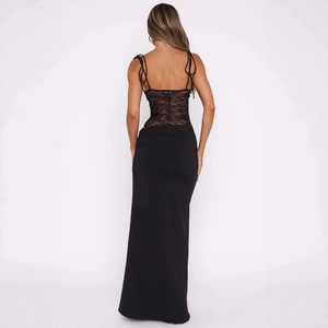 Detail of sexy black backless dress with fine lace patchwork and thin spaghetti straps