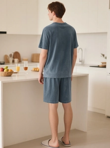 Men's lounge set in blue velvet showing back view in a modern kitchen setting