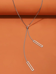 Detail of adjustable silver square box chain with sliding bead and dual rectangle pendants