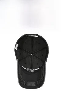 Detail view of washed cotton baseball cap showing interior embroidery and breathable design