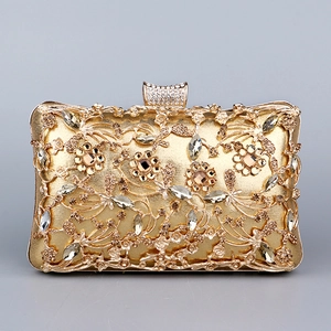 Luxury gold evening clutch bag with hollow floral pattern and sparkling crystals