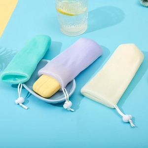 Detail of 6-layer mesh soap saver pouch set in mint green, lavender and cream white colors