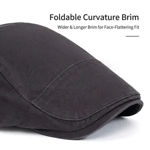 Dark grey cotton newsboy cap with adjustable brim and detailed double stitching