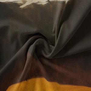 Close-up of abstract artistic print fabric with smooth texture and silk luster finish