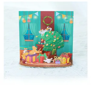 Detail einer 3D-Weihnachtskarte mit süßen Katzen um einen geschmückten Baum